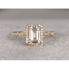 Best Emerald Cut Moissanite is made of 1.25 Ct Halo Moissanite & Moissanite Diamond Wedding Ring in 925 Silver with Rose Gold Plating. The crafted in superb semi-eternity style ring has .25 carat of real natural Moissanite Diamonds. The center stone is of 1.25 carats of real Moissanite. Lets feature this ring in the engagement ring trends of 2019. Size: 5.0.  Color: Yellow.  Gender: female.  Age Group: adult. Diamond Ring With Emerald, Ring With Emerald, Emerald Cut Engagement, Trending Engagement Rings, Emerald Cut Moissanite, Ring Trends, Moissanite Diamond Rings, Emerald Engagement Ring Cut, Gold Halo