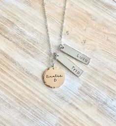 "Aunt Necklace Auntie Jewelry Personalized Jewelry Handstamped Jewelry Name Necklace Handstamped Necklace Charm Jewelry *Auntie necklace with names of loved ones. This necklace makes a loving gift to any member of your family or friends. * A 1\" Rose Gold disc stamped \"Auntie\" with \"Name of choice\" * 1 3/8\" stainless steel bar with name of choice * A 18\" stainless steel chain at check-out, please leave information **names All handstamped jewelry is packaged in gift box. Every piece is a ha Aunt Necklace Gift, Nickel-free Necklace For Mother's Day Personalized Gift, Adjustable Nickel Free Dog Tag Necklace, Stamped Charm Necklace For Mother's Day, Everyday Stamped Charm Necklace For Mother's Day, Hand Stamped Necklaces For Mother's Day, Personalized Dangle Charm Necklaces For Valentine's Day, Personalized Dog Tag Necklace For Mother's Day, Everyday Dog Tag Jewelry For Mother's Day