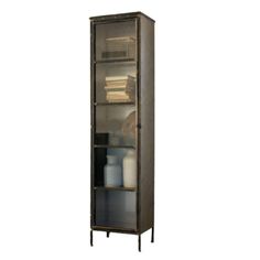 a tall metal cabinet with glass doors on the front and bottom shelves in dark brown