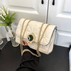 Material PU Trendy Cream Bag With Chain Strap, Luxury White Flap Bag With Chain Strap, Trendy White Bag With Chain Strap, Luxury White Bags With Chain Strap, Beige Shoulder Bag With Chain Strap, White Crossbody Evening Bag With Phone Holder, White Crossbody Evening Bag For Mobile Phone, White Box Bag With Mobile Phone Holder For Evening, Elegant White Satchel With Chain Strap