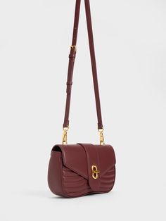 From the smooth curved silhouette, plush padded body and luxurious dark chocolate finish, our Aubrielle crossbody bag will have you channelling elegance and sophistication in an instant. It features a roomy interior that can hold your everyday essentials and more with ease. Plus points for the metallic turn-lock closure that adds a touch of shine that will add a shine to your look. Charles Keith, Special Promotion, Everyday Essentials, Dark Chocolate, Everyday Essentials Products, Adjustable Straps, Crossbody Bag, Product Launch, Faux Leather