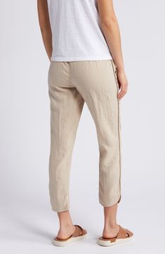 Pull-on pants with a cropped tulip hem are cut from lightweight, cool linen, which makes them ideal for sun-chasing adventures or kicked-back weekends at home. 26" inseam; 12" leg opening; 11" front rise; 16" back rise (size Medium) 24 1/2" petite inseam; 12" leg opening; 10 1/2" front rise; 15" back rise (size Medium P) Drawstring waist Front slant pockets 100% linen Machine wash, line dry Imported Spring Linen Capris With Elastic Waistband, Casual Linen Cropped Leg Capris, Casual Linen Cropped Capris, Casual Cropped Linen Capris, Spring Pants With Elastic Side Panels And Relaxed Fit, Spring Linen Ankle-length Capris, Spring Linen Cropped Pants, Linen Capri Pants With Pockets, Summer Bottoms With Elastic Side Panels And Loose Fit