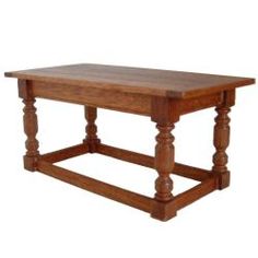 an old style wooden table with turned legs