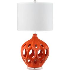 an orange table lamp with a white shade