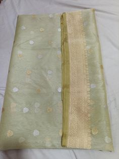 For any questions Whatapp Us: +4591718558 Visit www.silktatva.com for extra discounts Pastel Green Banarasi Handloom Pure Kora Organza Silk Gold & Silver Zari Kaduwa Weaving Saree Beautiful Kaduwa buttas in Gold and Silver zari Borders in Gold Zari weaving 100% Banarasi Pure Handloom Sarees Silk Mark Certified Saree includes unstitched blouse in the same color Ready to ship We do Saree Fall, Pico, Tassels on request only free of charge NOTE: While opting for the Customized product, please provid Silk Blouse Piece In Pista Green With Zari Weaving, Pista Green Silk Blouse Piece With Zari Weaving, Pista Green Tussar Silk Blouse Piece With Pallu, Pista Green Art Silk Traditional Wear Handloom, Pista Green Silk Handloom Traditional Wear, Pista Green Katan Silk Dupatta With Zari Weaving, Handloom Art Silk Dupatta In Pista Green, Silk Dupatta With Zari Weaving In Pista Green, Pista Green Handloom Art Silk Dupatta