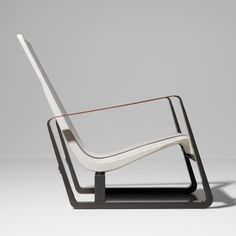 a white chair sitting on top of a black stand