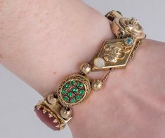 What a fun find!  This colorful and chunky antique Victorian slide bracelet is one that you must add to your eclectic jewelry collection!  This little treasure can be dressed up or down and it will draw a little bit of attention from admirers for sure. Antique Bracelet - Antique Victorian 14k & Gold Filled Colorful Gemstone Slide Bracelet  Victorian 7 Charms 14k Yellow Gold (1 charm) Gold Filled (6 charms) Carnelian, Blue Zircon, Moonstone, Bloodstone Bracelet measures approximately 6.75" long a Heirloom Gold Multi-stone Bracelets, Heirloom Gold Bracelets With Multi-stone, Antique Multi-stone Bracelet As Gift, Antique Multi-stone Bracelets As Gift, Vintage Yellow Gold Bracelet With Jewels, Vintage Yellow Gold Bracelets With Jewels, Vintage Green Jubilee Bracelet, Vintage Multi-stone Bracelets Gift, Collectible Costume Jewelry Bracelets In Yellow Gold