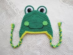 a crocheted frog hat with eyes and ears