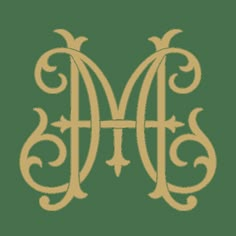 the letter m in gold on a white background