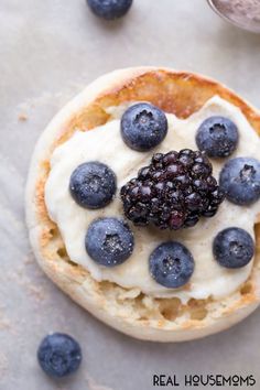 a pastry topped with blueberries and whipped cream