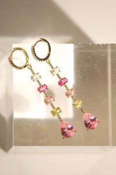 Expertly crafted, these earrings are made with 14K gold vermeil and adorned with a mix of pink multi-cz droplets, measuring at 3 inches. Embrace the vibrant yet elegant design of these huggie earrings that will make a statement for any occasion. Huggie Earrings, Huggies Earrings, Gold Vermeil, Elegant Design, Gems, Pink, Gold, Design