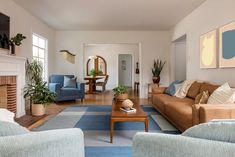 a living room filled with furniture and a fire place