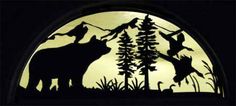 the silhouette of an animal is shown in front of a full moon with trees and mountains