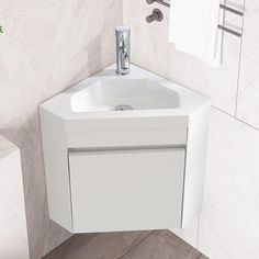 a white sink in a bathroom next to a towel rack and toilet paper dispenser