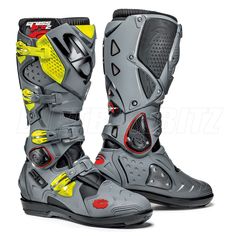 a pair of grey and yellow motorcycle boots