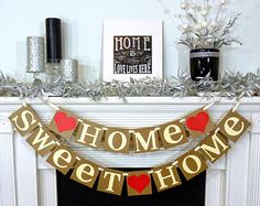 a home sweet home banner hanging over a fireplace