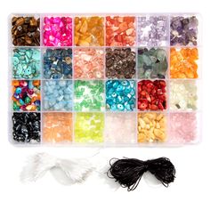 the bead box is filled with many different colors of beads and black stringing