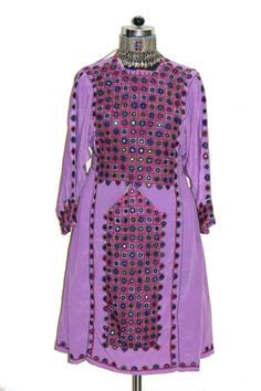 "Item Description Vintage Collection Baluchi Dress Truly amazing gypsy and bohemian vintage authentic Afghanistan treasure. This unique garment is made from vintage textiles hand crafted in Afghanistan. This dress is from Afghanistan and artistically created from vintage pieced fabric. It is all hand made and hand brought from India & pakisthan border ariya . It has a loose silhouette that falls in length to the knee. This garment is a stellar example of the amazing textiles that influence fashi Traditional Summer Kurta With Sequins, Traditional Sequined Summer Kurta, Traditional Spring Kurta With Sequins, Bohemian Kurta With Mirror Work For Eid, Bohemian Embellished Kurta For Navratri, Navratri Festival Kaftan With Mirror Work, Pink Spring Dress With Mirror Work, Pink Spring Dresses With Mirror Work, Eid Tunic Dress With Mirror Work