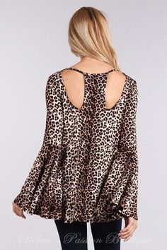 Solo La Fe Extra wide bell sleeves top, cut out neckline front and back. Soft jersey fabric. Extra long sleeves.Color: Animal Print Sizes S-M-L Bust 34-36-38, Length 26, our model is 5' 3" and wearing small 95% Rayon, 5% Spandex, Jersey, Made in USA B4/TD3280A Long Sleeve Tops For Brunch, Flowy Long Sleeve Party Tops, Flowy Bell Sleeve Tops For Fall, Chic Leopard Print Long Sleeve Tops, Chic Long Sleeve Leopard Print Top, Fall Stretch Tops With Bell Sleeves, Fall Bell Sleeve Tops For Brunch, Stretch Bell Sleeve Tops For Fall, Bell Sleeve Tops For Fall Brunch