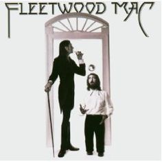 two men standing next to each other in front of a doorway with the words fleetwood mac on it