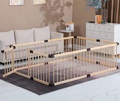 a baby crib sitting in the middle of a living room