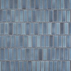 a close up view of a blue tile wall