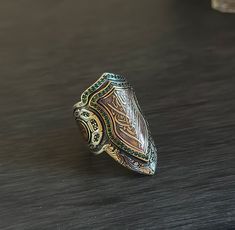 Introducing our exquisite Shield Ring, inspired by the Ottoman style and handcrafted with Afghan Silver. This unique men's ring is a perfect gift for him, showcasing Islamic engraving on the ring's surface, adding a touch of cultural significance. Crafted in a rustic design, this ring offers a bold and distinctive look. Available in size 10.5, this handmade ring combines craftsmanship with historical aesthetics. Elevate your style with this one-of-a-kind Shield Ring, embodying tradition and artistry. Rustic Mens Rings, Unique Mens Rings, Shield Ring, Mens Ring Sizes, Ottoman Styling, Perfect Gift For Him, Size 10 Rings, Silver Gifts, Multi Stone Ring