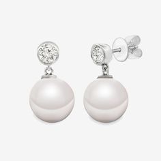 Add a touch of sheer elegance with our pearl drop earrings. The bezel-set round brilliant-cut diamond solitaire will catch the eye, while the pearl drop adds a classic touch. Handcrafted in 14K yellow or white gold, they are perfect for any occasion. Natural Freshwater Pearls: 8.5-9mm Natural Diamonds: 0.25ctw 14K Yellow or White Gold Length: 1/2 Inch The Pearl, Bezel Diamond, Pearl Drop Earrings, Pearl Drop, Round Brilliant Cut Diamond, Diamond Solitaire, Bezel Setting, The Eye, Round Brilliant