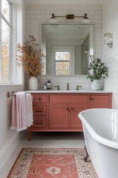 a bath room with a tub a sink and a large mirror on the wall above it