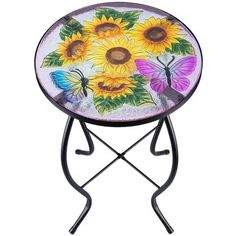 a table with sunflowers and butterflies painted on the top, sitting on a stand