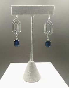 These Deco dangles are the perfect earrings for a 1920s themed wedding or party. Sapphire blue vintage glass beads dangle from silver plated brass Art Deco style connectors. The silver plated brass stampings have an ornate front and a reverse side that is slightly hollow. (SEE 2nd PHOTO) These earrings are lightweight (lobe friendly) yet sturdy, free of lead and nickel. The earrings measure 2 1/4 inches long from the top of the ear wires to the bottom of the glass beads. They hang from silver pl Victorian Style Party Chandelier Earrings, Victorian Chandelier Dangle Earrings For Party, Victorian Dangle Chandelier Earrings For Parties, Formal Art Deco Bridal Dangle Earrings, Formal Art Deco Dangle Bridal Earrings, Victorian Dangle Earrings For Party, Art Deco Dangle Bridal Earrings For Formal Occasions, Formal Art Deco Dangle Chandelier Earrings, Art Deco Dangle Chandelier Earrings For Formal Occasions