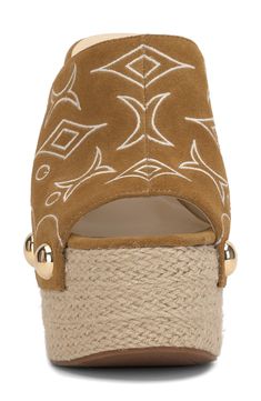 Glam goldtone studs dot the sides of a beautifully embroidered sandal set atop a meticulously woven platform wedge that's ready for paradise. 5 1/2" heel; 2 1/2" platform Leather upper/synthetic lining/rubber sole Imported Designer Beach Wedge Sandals With Platform, Platform Wedge Sandals, Platform Wedge, Wedge Sandal, Sandal Women, Platform Wedges, Jessica Simpson, Wedge Sandals, Saddle