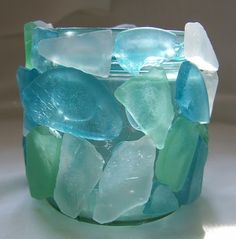 a glass vase sitting on top of a white table