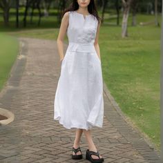 Keep it fresh and fashionable this summer with our Linen Midi Dress. This sleeveless, split neck white dress, perfectly designed for those hot summer days, ensures you stay comfortable while looking chic.  ★★FEATURES 100% Linen Two side pockets White cotton lining Split V neck dress Right hidden zipper Sleeveless Linen dress Linen midi dress Below knee length Minimalist Dress Perfect for summer,spring Other more color selection ★★ Bespoke Order Service If you Request other color Request the leng White V-neck Sleeveless Dress For Summer, Casual White A-line Maxi Dress, Sleeveless Linen Dress In Solid Color, Sleeveless Solid Color Linen Dress, White A-line Sleeveless Dress For Day Out, Chic White Sleeveless Dress, White Sleeveless Summer Dress For Day Out, White Sleeveless Dress For Summer Day Out, White V-neck Sleeveless Summer Dress