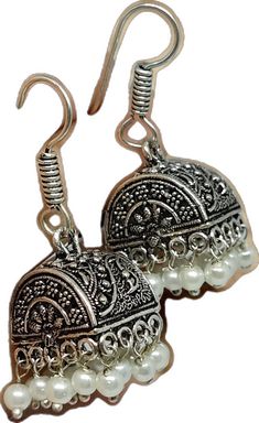 Traditional Dangle Pearl Earrings, Traditional White Pearl Earrings, Traditional White Pearl Pierced Earrings, Intricate Metal Earrings For Diwali, Metal Earrings With Intricate Design For Diwali, Festive Silver Pearl Pierced Earrings, Silver Pierced Pearl Earrings For Festive Occasions, Ornate Jhumkas For Pierced Ears, Ornate Metal Jhumkas For Gifts