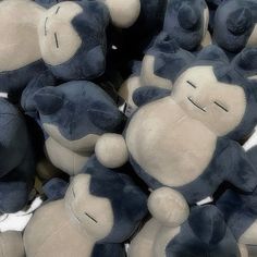 a pile of blue and white teddy bears