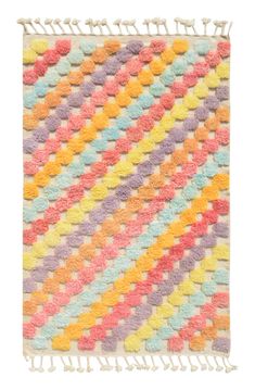 a multicolored rug with fringes on it