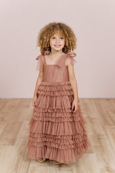 Let your little one twirl away in our Tallulah Tulle dress. Tallulah features a square neckline with one layer of tulle straps that self-tie into bows and is finished with a tiered ruffle skirt. Perfect for the flower girl that loves to dance the day away! Model Spencer; Size: 3T / Length: Regular, Age: 3, Height: 3'5 Model Marleese; Size: 4T / Length: Regular, Age: 5, Height: 3'8 FEATURES: Flowy A-line silhouette Square neckline Self-tie spaghetti straps Back zipper Full-length double lining fo Flowergirls Dress Fall, Fall Flower Girl Dresses, Bohemian Flower Girl Dress, Tulle Ruffle Dress, Alt Wedding, Tulle Straps, Wedding Parties Colors, Semi Formal Wedding, Girls Tulle Dress