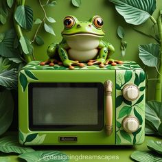 a frog sitting on top of a green microwave oven in front of leaves and plants