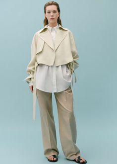 100% linen cropped trench coat - Women | Mango USA Modern Linen Outerwear With Lapel Collar, Chic Cropped Jacket With Lapel Collar For Spring, Chic Beige Cropped Jacket With Lapel Collar, Elegant Spring Outerwear With Fold Down Collar, Beige Linen Collared Outerwear, Chic Linen Outerwear For Daywear, Beige Linen Outerwear For Office, Modern Cropped Jacket With Lapel Collar For Spring, Neutral Linen Outerwear For Work