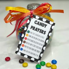 a jar filled with candy sitting on top of a table