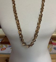 This listing is for a long gold-tone circular chain link necklace. This necklace has a beautiful shine to it, which makes me wonder if it is gold-plated. There are no markings. It is 32" long with an extra 2 1/2" extension chain. The discs are about 1/2" in diameter. A perfect necklace for the holidays! The shipping weight will be 3 ounces. Gold Chunky Chain Long Necklace, Gold Link Chain Necklace For Party, Formal Gold Necklace With Chain Strap, Formal Gold-tone Long Necklace With Chain, Gold Metal Chain Necklace Costume Jewelry, Gold Metal Long Necklace, Gold Oval Link Chain Necklace For Party, Gold Long Necklace With Adjustable Chain For Party, Gold-tone Long Chain Necklace