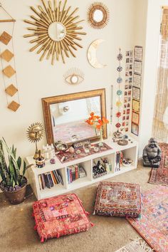 a living room filled with lots of furniture and decor on top of carpeted flooring