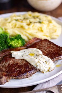 steak, mashed potatoes and broccoli on a plate