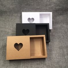 three boxes with hearts cut out of them