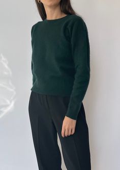 Cropped 1970s-80s vintage mohair jumper. No label but knitted with mohair, in a deep forest green colour. Features a long sleeve, crew neck and ribbed hem. Size - XS/S / UK 6-10 / US 2-6 / EU 34-38.  Model is 5'4 and a size UK 6-8.  Hem circ: 92cm  / Sleeve length: 58cm / Length: 53cm Excellent condition. Sourced in the UK, based in London. Green Wool Turtleneck Sweater, Fitted Green Wool Sweater, Green Mohair Crew Neck Sweater, Green Mohair Cozy Sweater, Cozy Green Mohair Sweater, Green Mohair Winter Sweater, Forest Green Sweater Outfit, Dark Green Sweater Outfit, Green Jumper Outfit