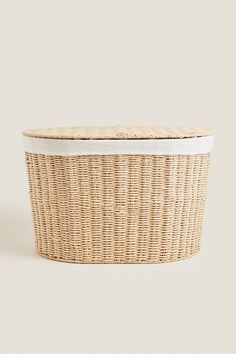 wicker basket with lid on white background