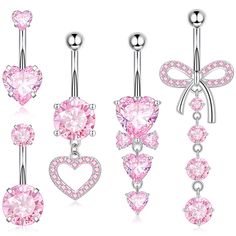 three different types of belly piercings with pink crystal heart and bowknote