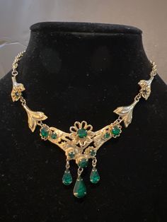 Beautiful estate find. Measures 14". Detailing is amazing. All green rhinestones in place. Green Jeweled Emerald Necklace, Green Emerald Jeweled Necklace, Green Rhinestone Necklaces For Formal Occasions, Elegant Jeweled Green Emerald Necklace, Ornate Green Jewelry With Jewels, Elegant Green Rhinestone Necklace With Jewels, Formal Green Rhinestone Necklaces, Formal Green Rhinestone Jewelry, Elegant Green Rhinestone Necklace