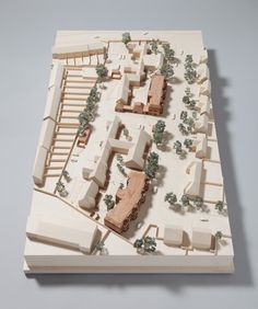 a model of a city with trees and buildings